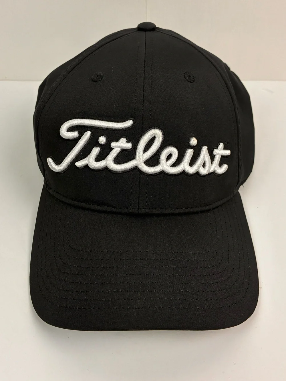 Titleist Tour Performance hat featuring embroidered Spectrum on the back OS